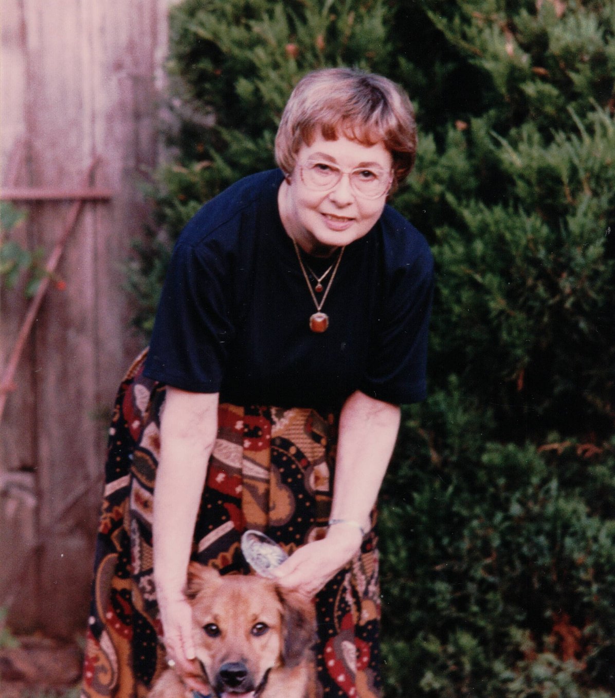 Woman smiling with dog after Bible study